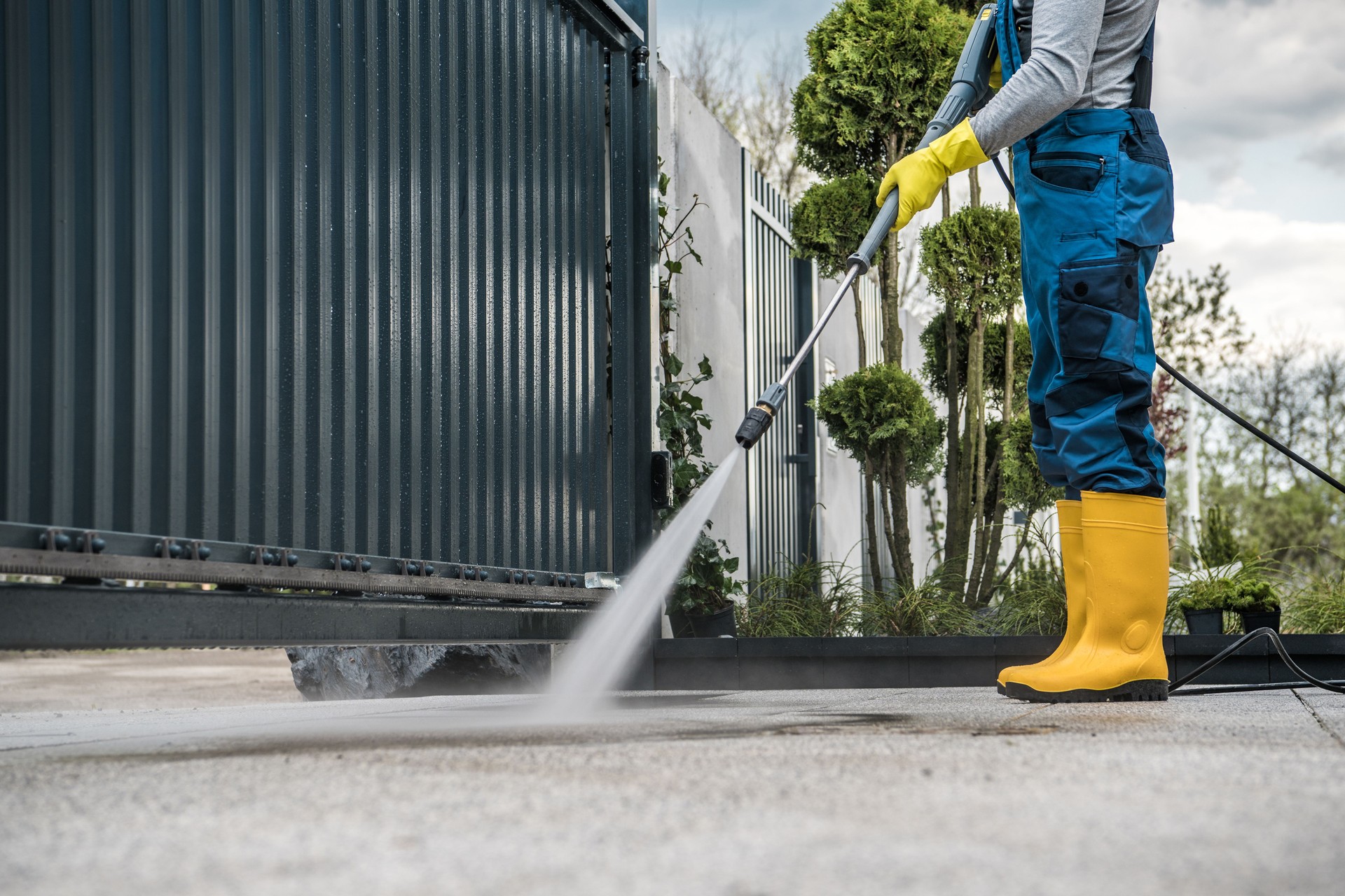 Man Washing the Driveway