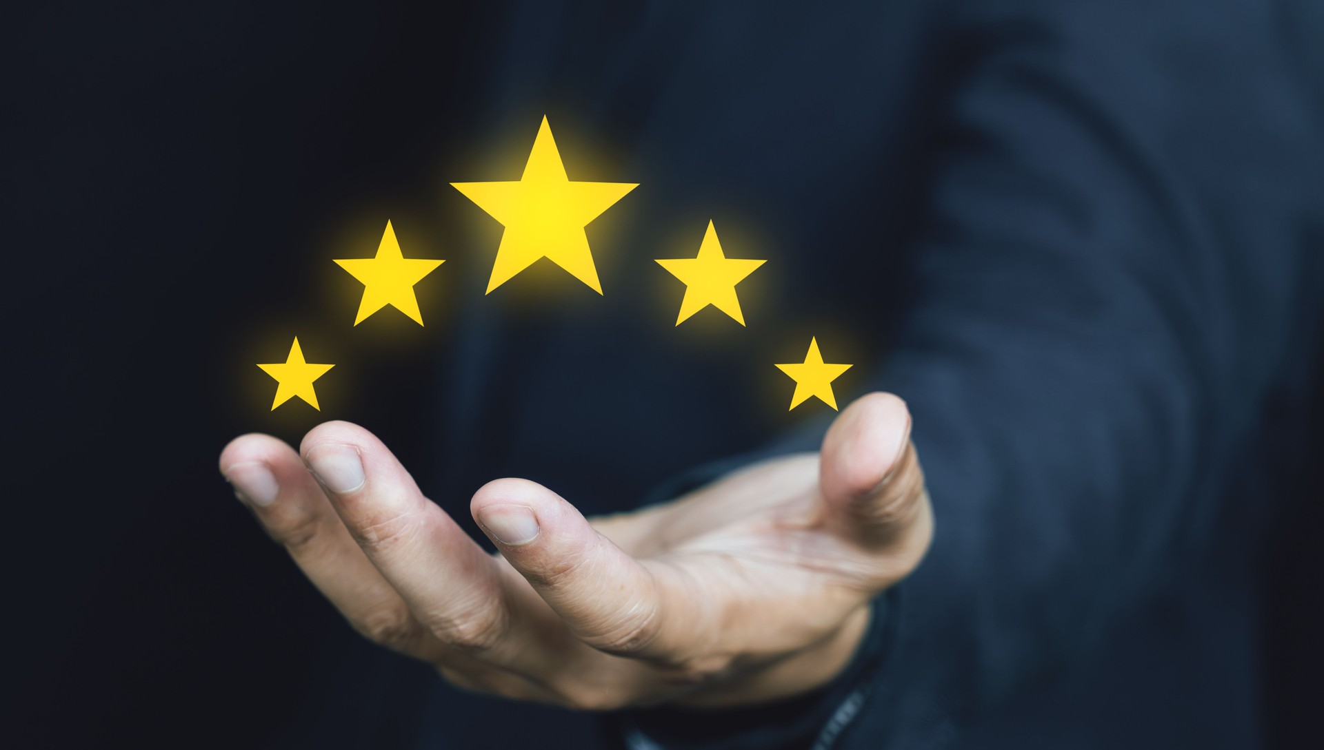Customer review good rating concept hand pressing five star on visual screen and positive customer feedback testimonial.
